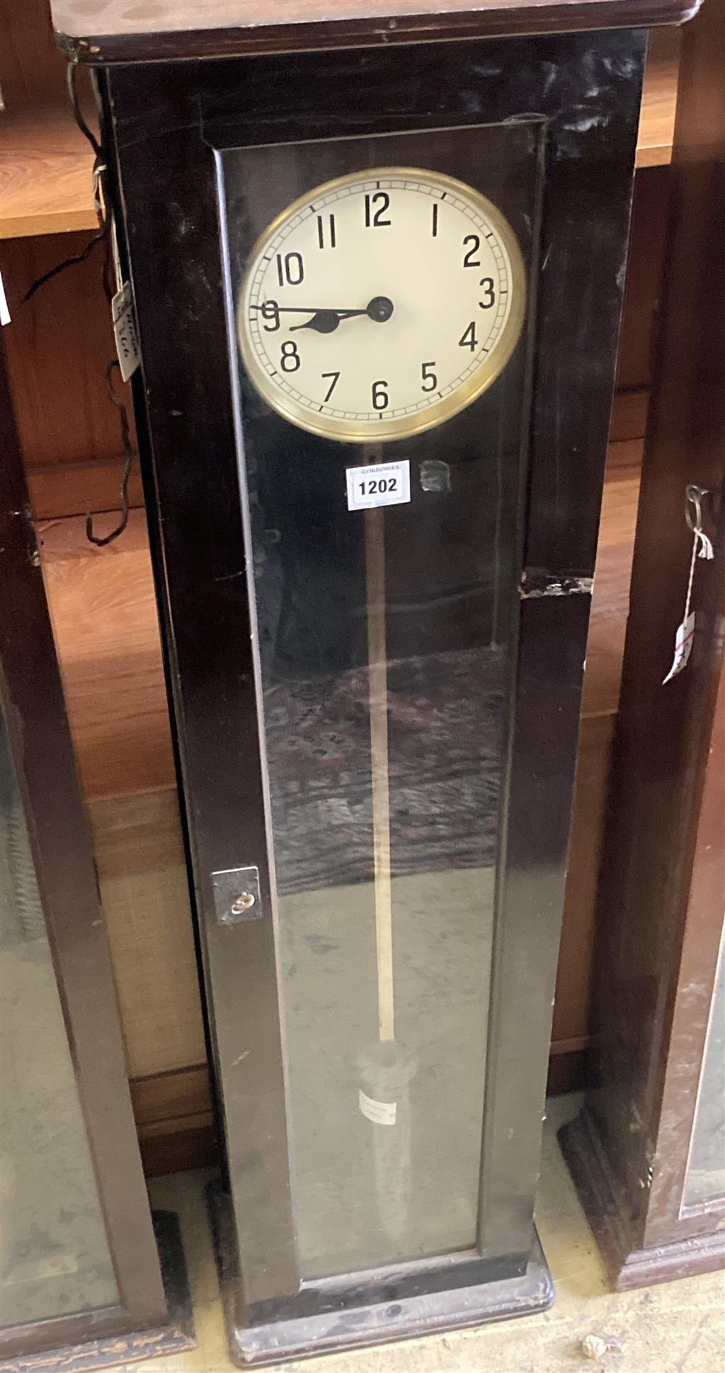 A Pul-Syn-Etic Impulse electric master clock in a beech case, with label for date and manufacture, 29-3-47, height 137cm. with pendulum